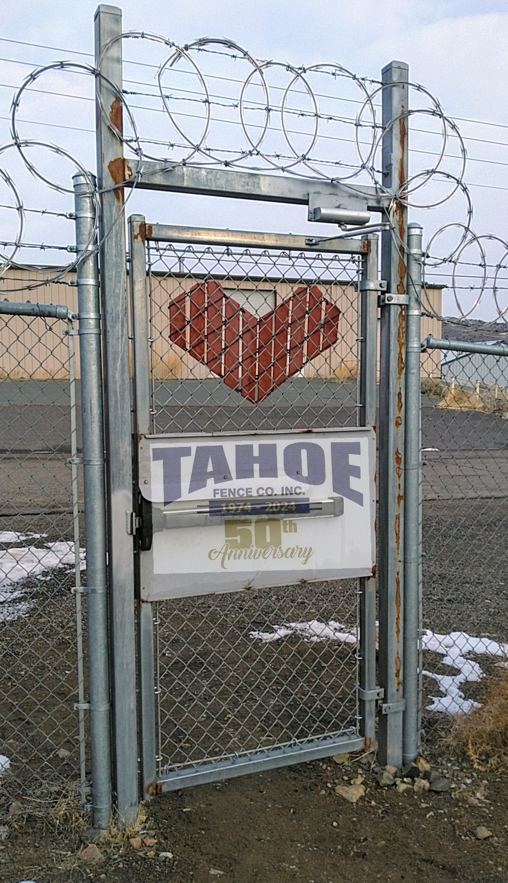 Lock In the Love

Lock in the love this Valentine's. Let those you care about know how special they are to you.

Happy Valentine's Day!

Pictured: Chain link security gate with panic hardware and Valentine's heart cut from redwood slatted privacy wire in Mound House (Lyon County.) 2024